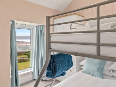 Family room in Apartment 2 with bunk beds, the lower one being a double. The room overlooks Broad Haven beach